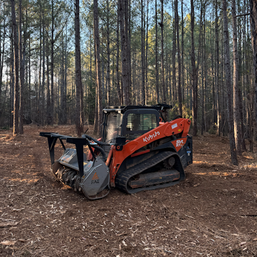 Skid Steer Grinding Stump Down